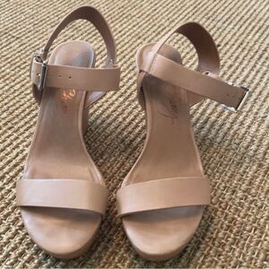 Tan wedge heel with gold buckle